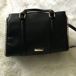 Black BCBG purse with gold embellishments